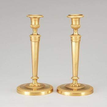 A pair of French Empire early 19th Century candlesticks.