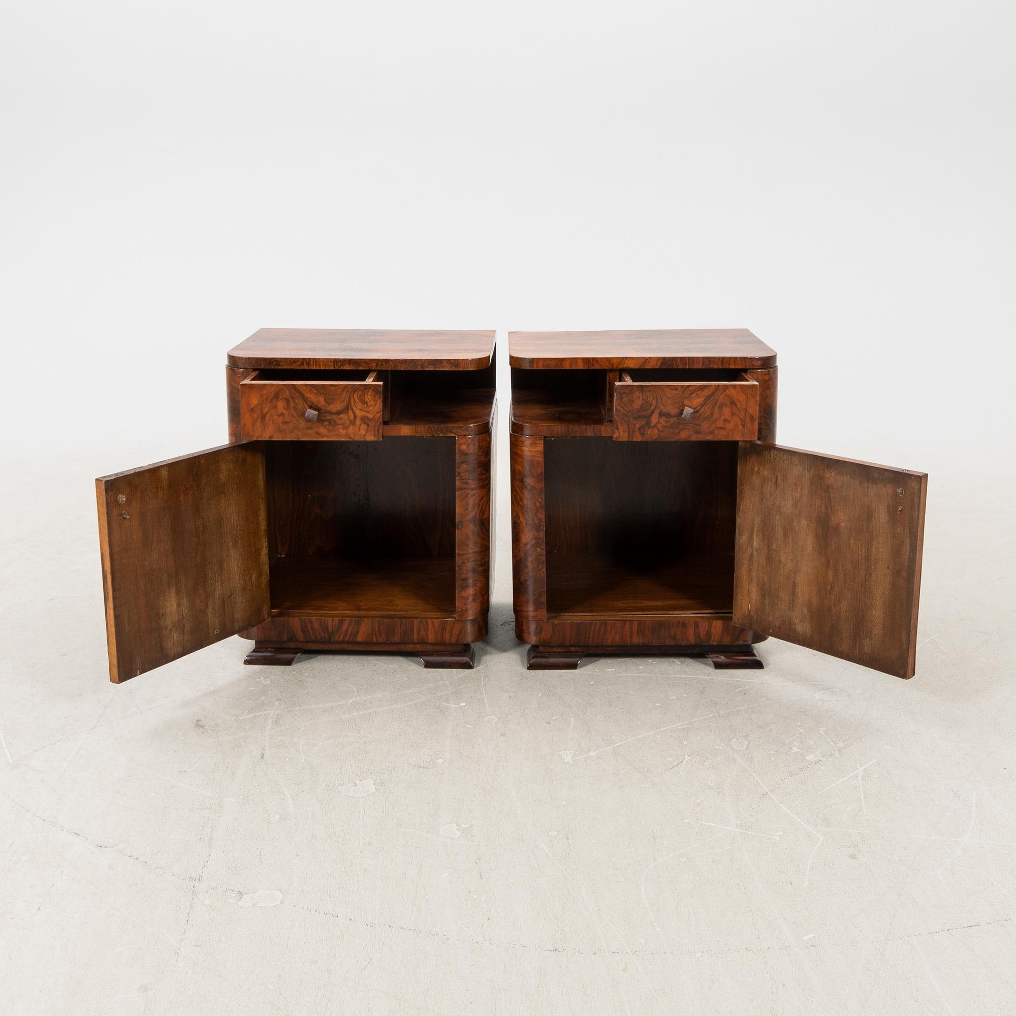A pair of Art Deco walnut bedside tables.
