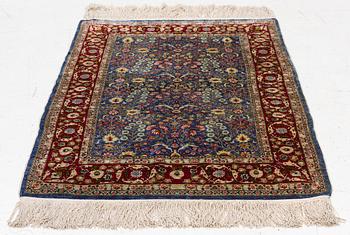 An Oriental silk rug, signed, c. 125 x 85 cm.