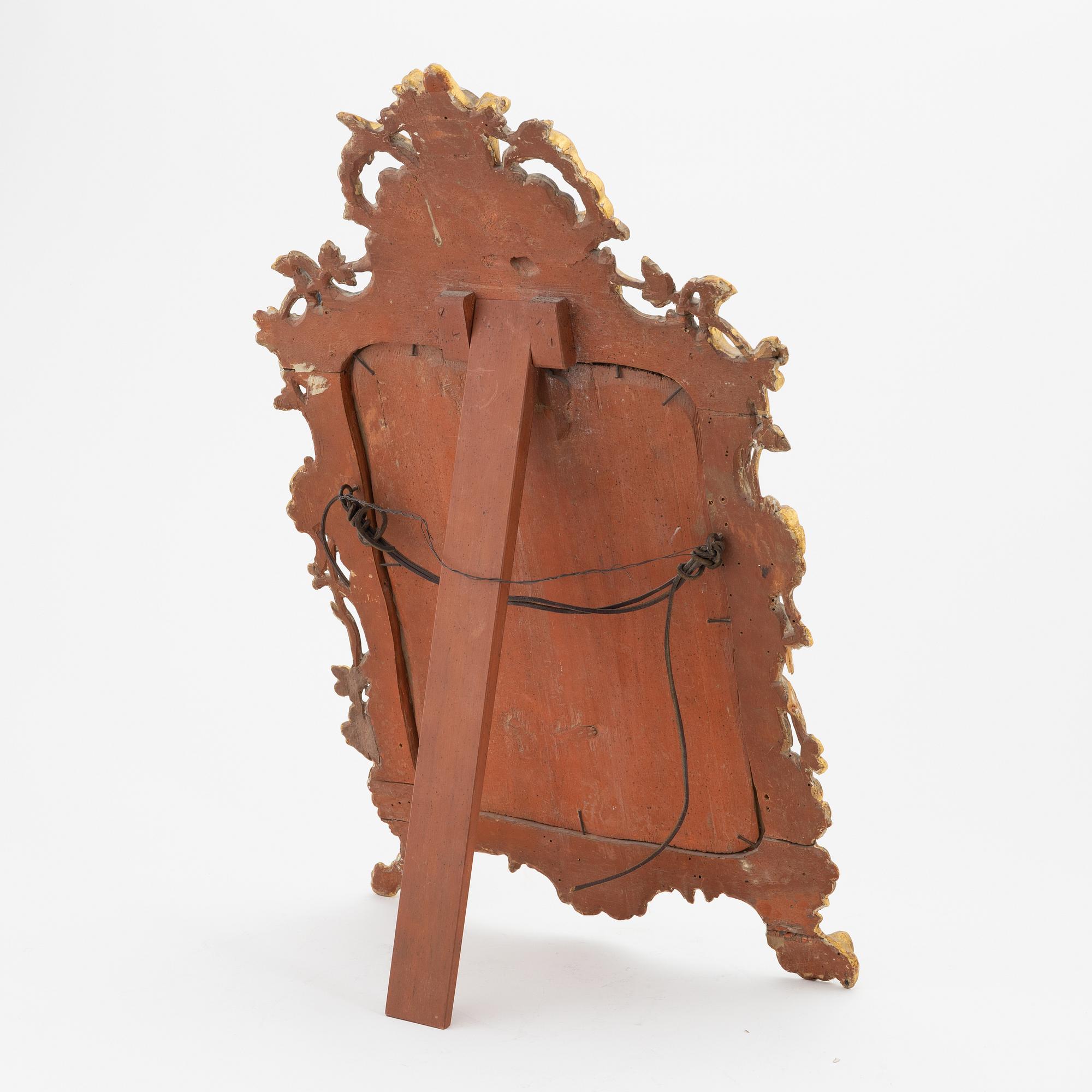 A Rococo style table mirror, probably southern Europe, around the year 1900.