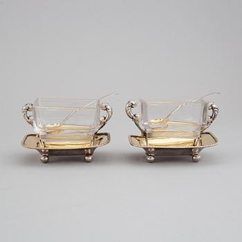 A pair of Swedish 19th century parcel-gilt silver and glass jelly-bowls, mark of Carl Tengstedt, Gothenburg 1839.