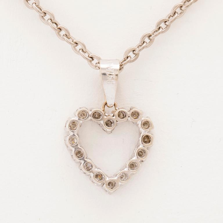 An 18K white gold pendant set with round brilliant cut diamonds.