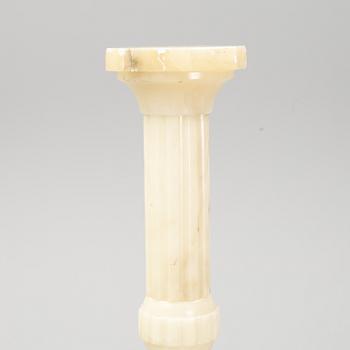 A 20th century alabaster pedestal.