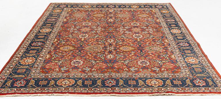 An antique/semi antique Tabriz carpet, c. 325 x 229 cm.