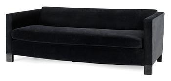 453. An Uno Åhrén black velvet and stained birch sofa by Firma Svenskt Tenn, circa 1930.