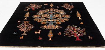 A figural oriental Carpet, circa 263 x 201 cm.