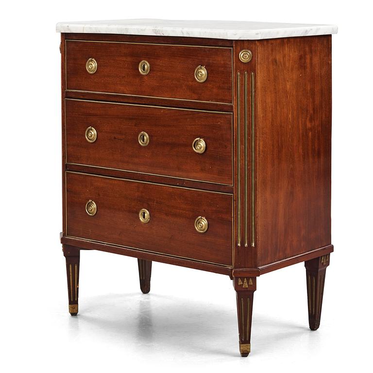 A late Gustavian mahogany, brass-mounted and marble-top commode by C. G. Foltiern (master in Stockholm 1804-29).