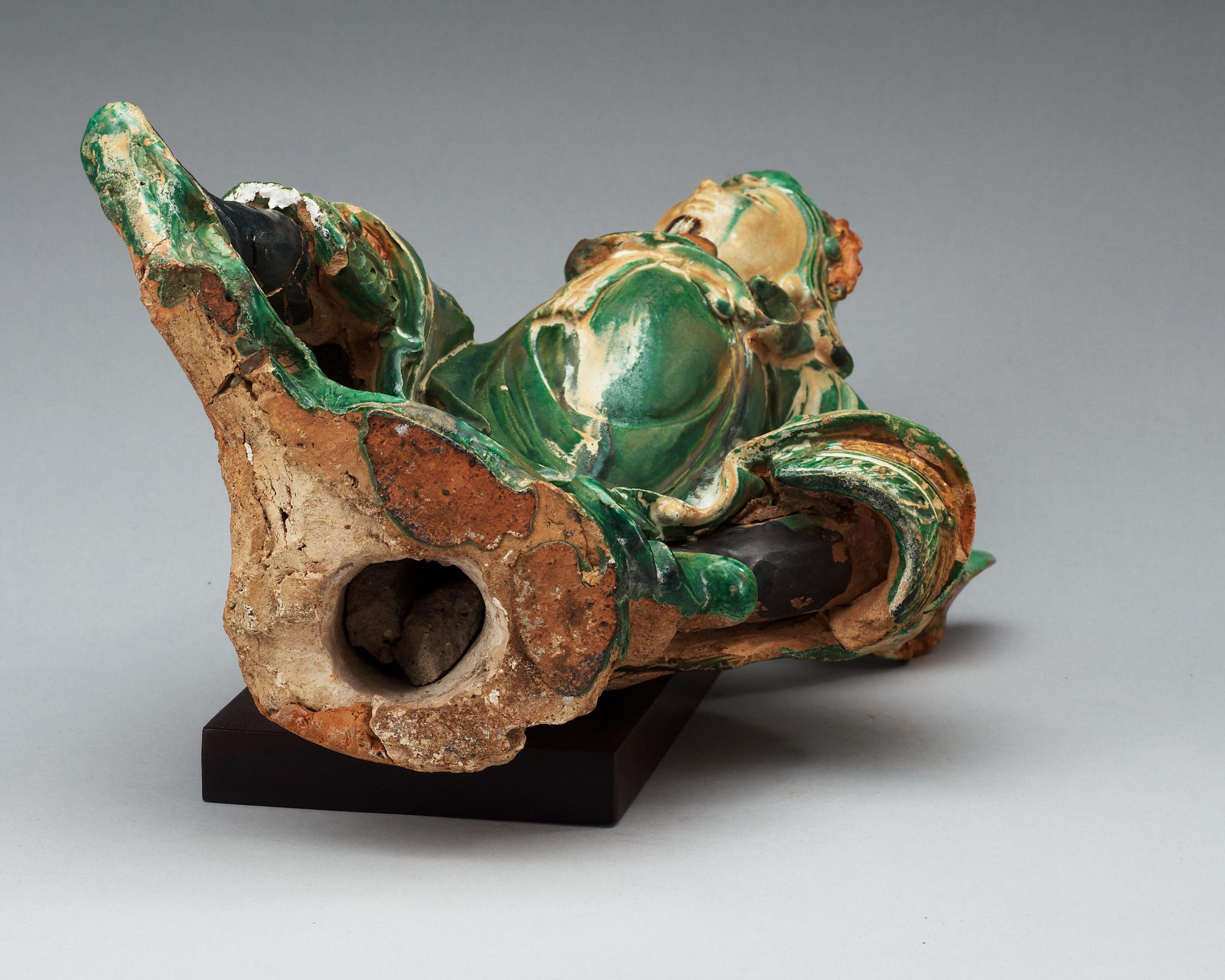 A gren and yellow glazed roof tile figure, Ming dynasty.