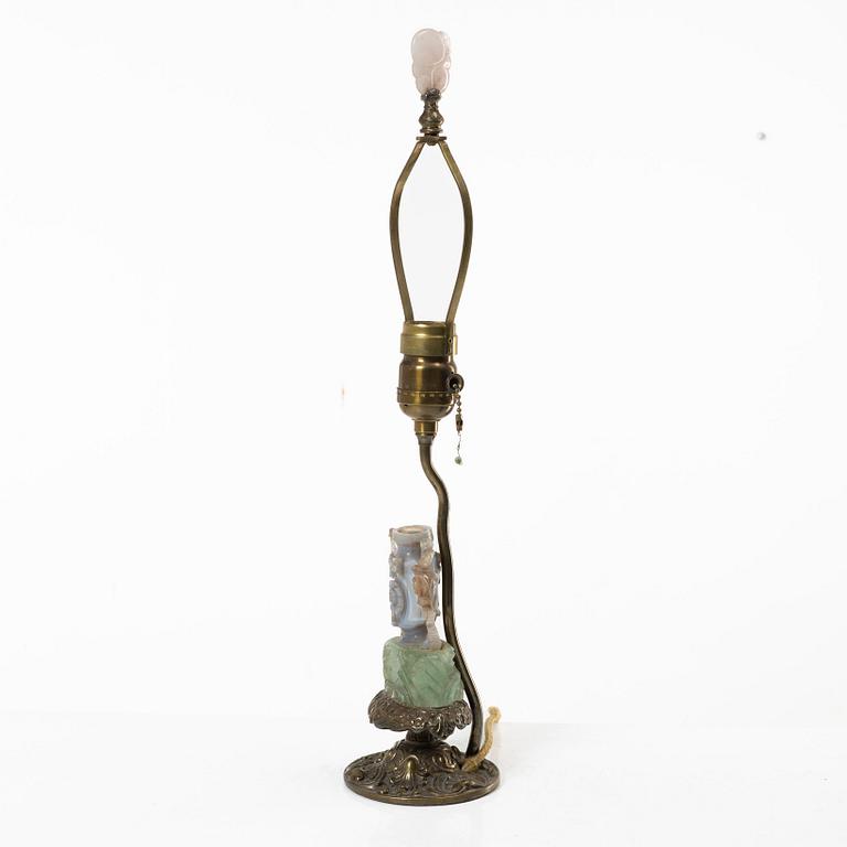 A Chinese table lamp with a carved stone vase with cover, 20th century.