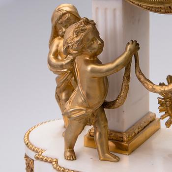 A neoclassical, French mantel clock, ca 1840-1860.