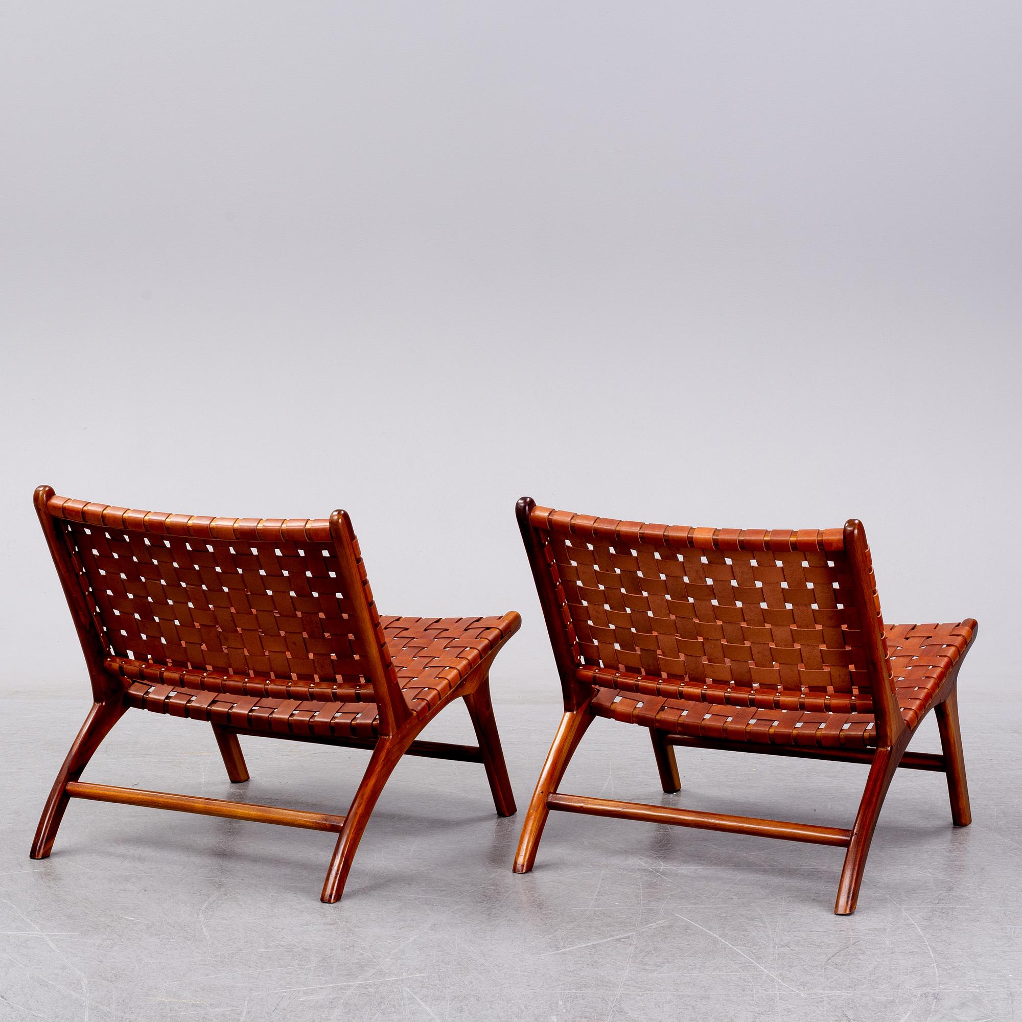 A pair of 'Porto' teak easychairs by Newport.
