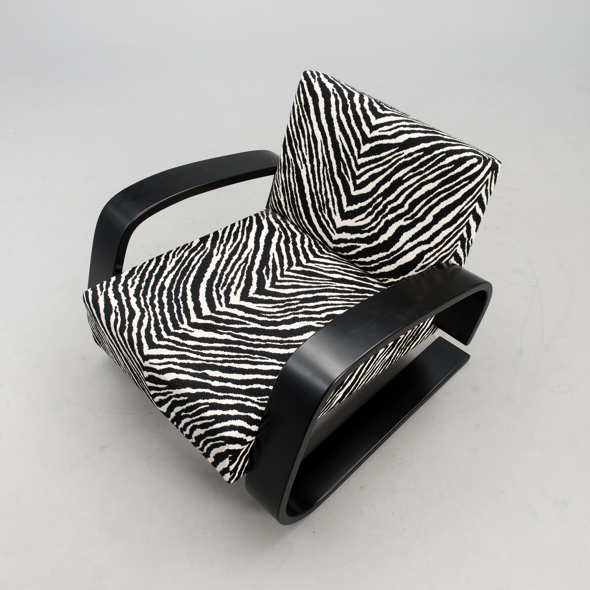 An armchair no 400, designed in 1936.