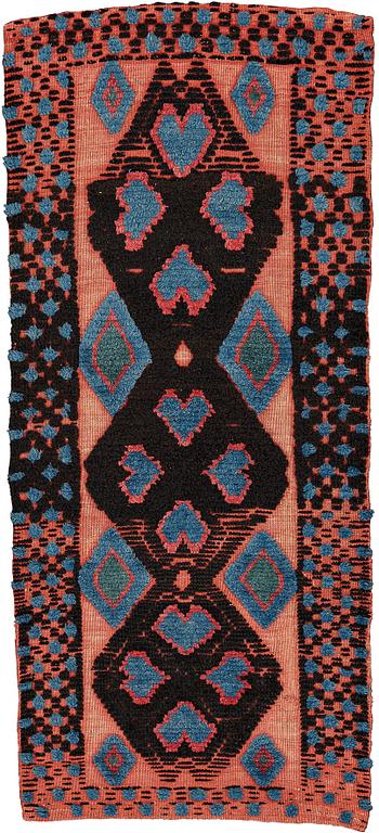 A CARRIAGE CUSHION, knotted pile in relief, ca 43,5 x 100 cm (with mounting 51 x 107,5 cm), southwestern Scania, Sweden.