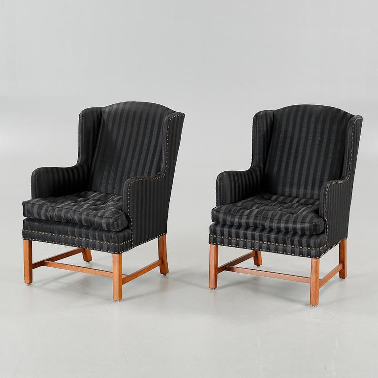 A pair of lounge chairs, late 20th / early 21st century.