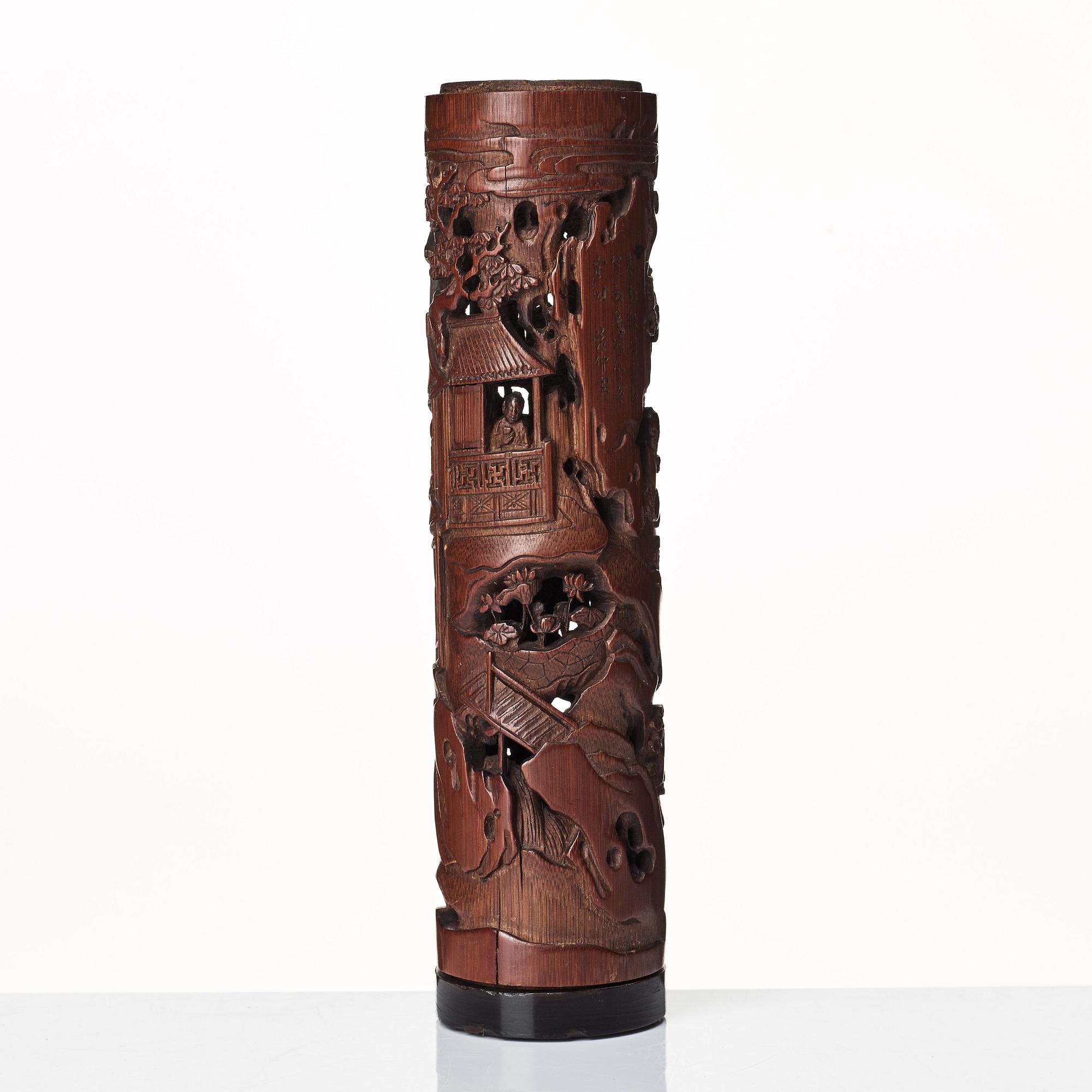 A carved cylindrical bambo parfumier, Qing dynasty, 19th Century.