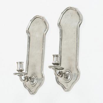 A pair of 1920s-30s tin sconces.