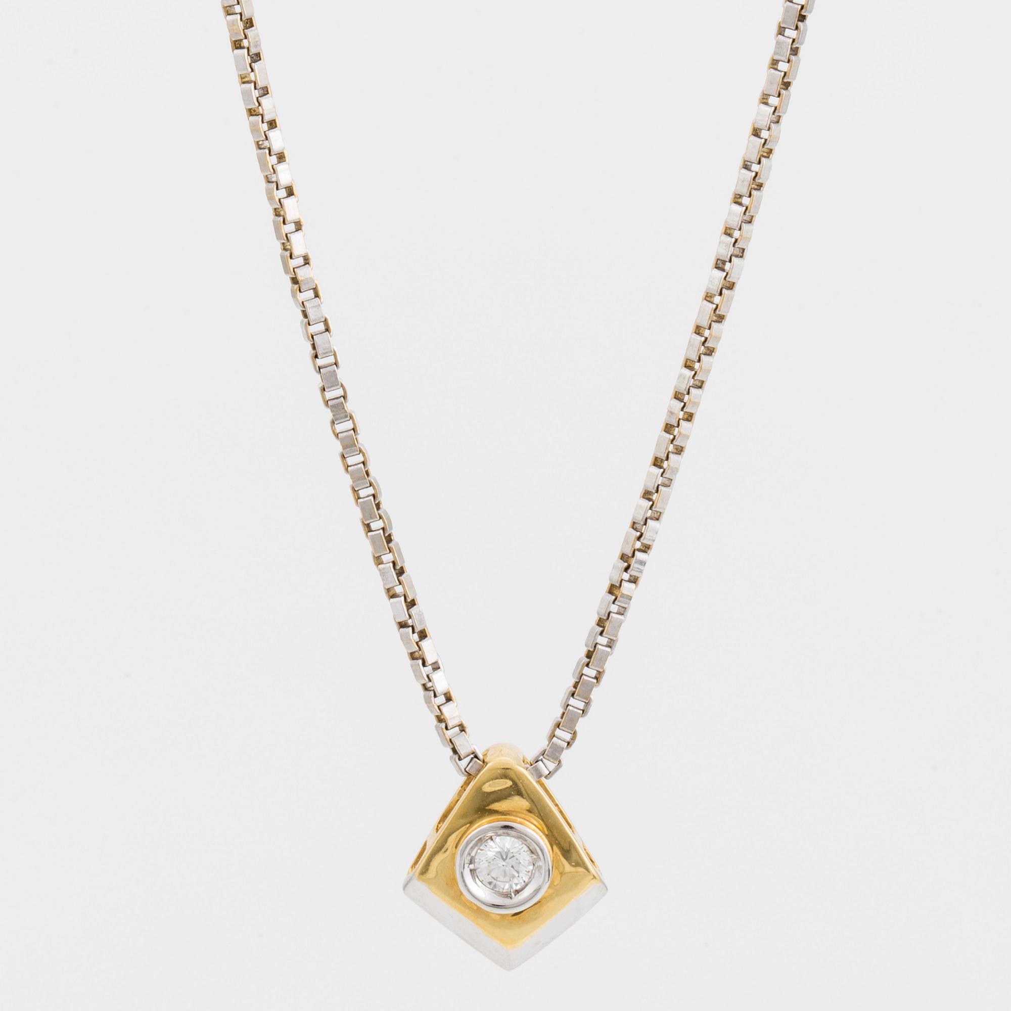 A chain and a pendant set with a round, brilliant-cut diamond.