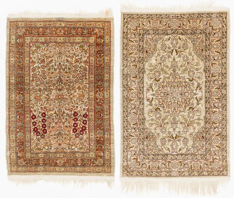 Two Silk Hereke Rugs, circa 87 x 60 and circa 90 x 60 cm.