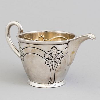 A Danish Art Nouveau parcel-gilt cream jug, maker's mark Franz Hingelberg, Aarhus 1909.