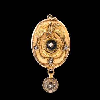 Pendant photo locket in 8K gold and silver.