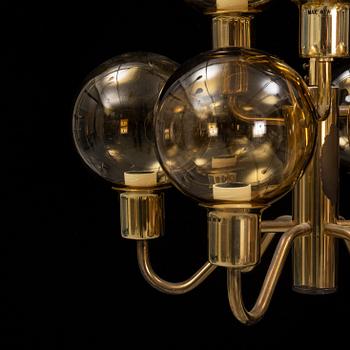 Hans-Agne Jakobsson, a late 20th century brass and glass ceiling lamp for nine lights, Markaryd, Sweden.