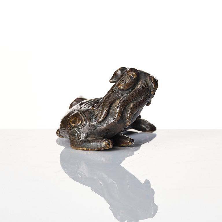 A group of four bronze figures, Ming dynasty and older.