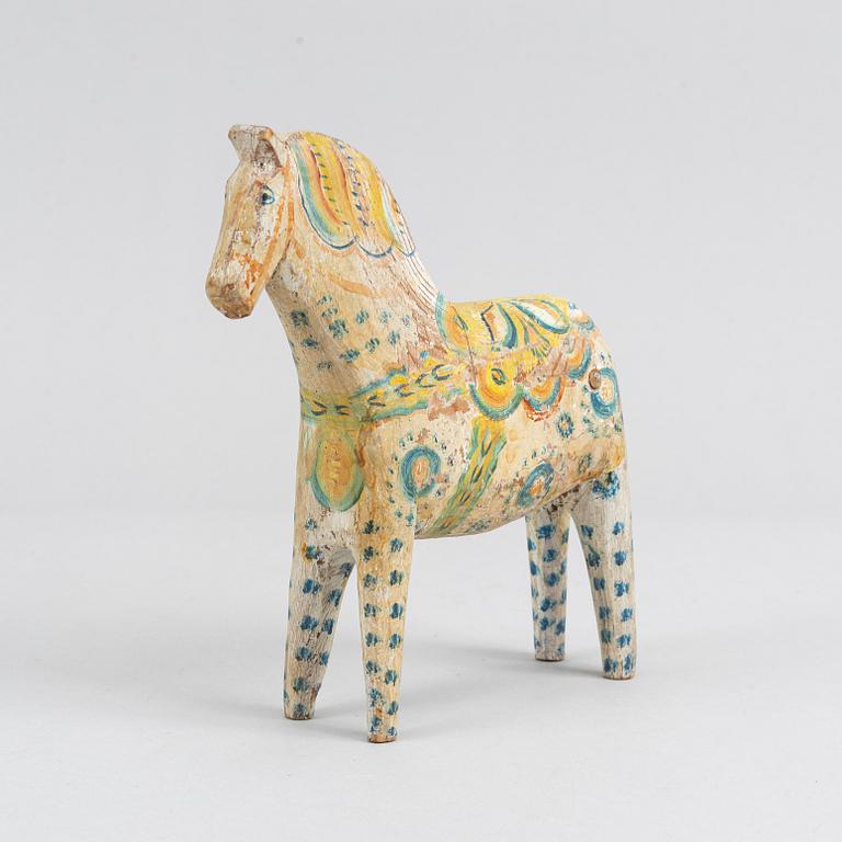 A painted Swedish wooden horse from the first half of the 20th century.