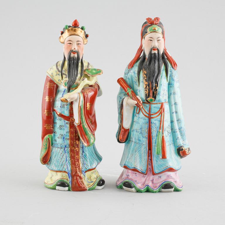A pair of chinese figurines.
