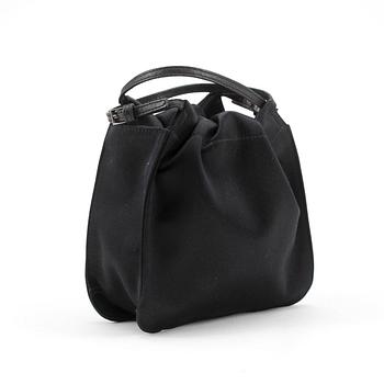 GUCCI, a black silk evening bag.
