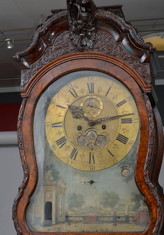 A LONGCASE CLOCK.