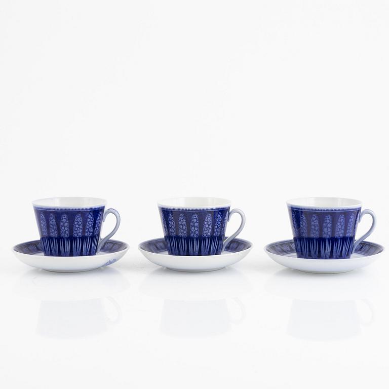 Arthur Percy, a set of three creamware "Blue Hyacinth" teacups with saucers, Gefle Porslinsfabrik, Sweden.