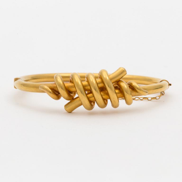 A 14K gold bracelet.