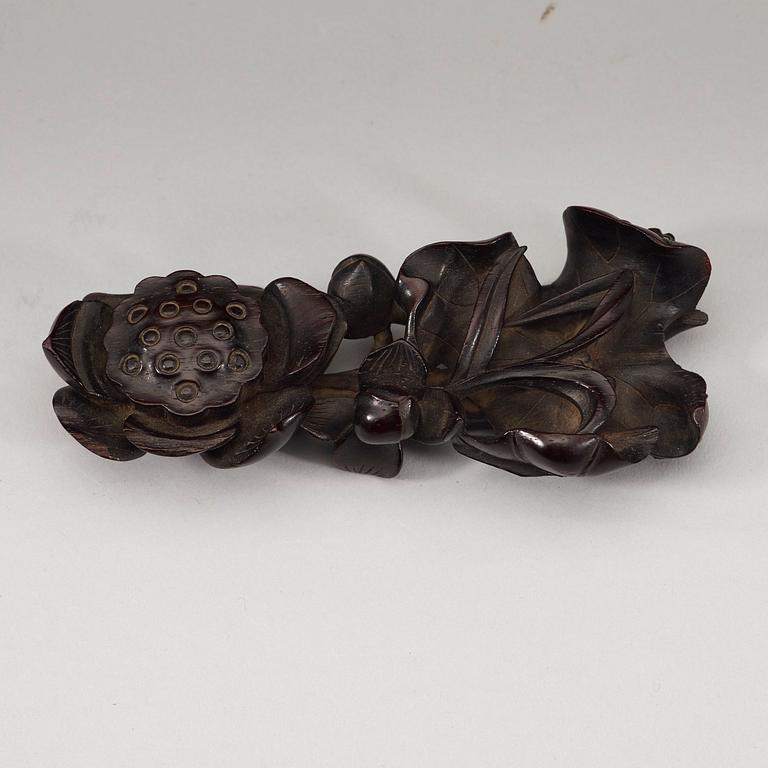 A finely carved Zitan "Lotus" stand, Qing Dynasty (1644-1912).