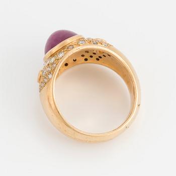 A cabochon cut opaque ruby and brilliant cut diamond ring.