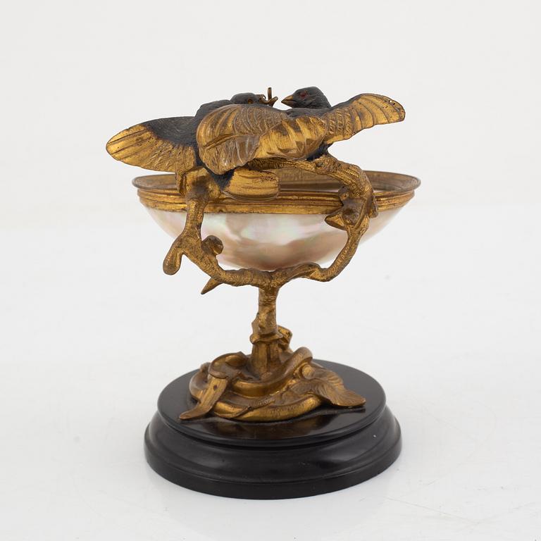 A gilt-bronze and mother of pearl stand for a pocket watch, later part 19th century.