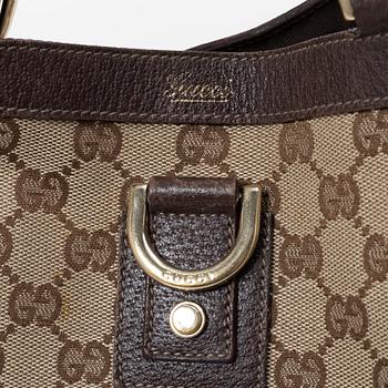 Gucci, a canvas and leather bag.