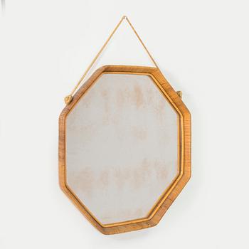 A 1950s rattan mirror.