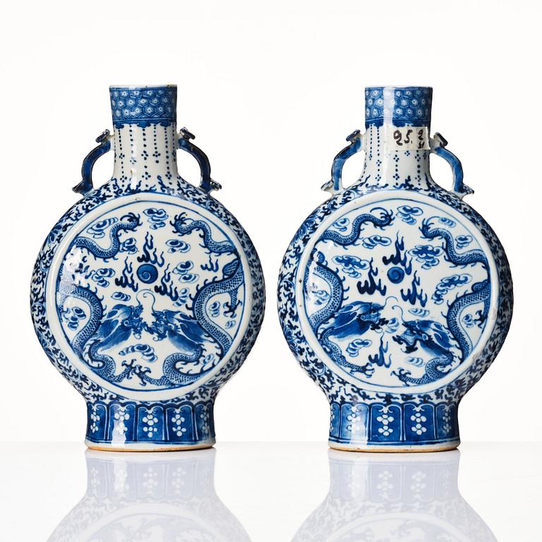 A pair of Chinese blue and white pilgrim vases, Qing dynasty, 19th Century.