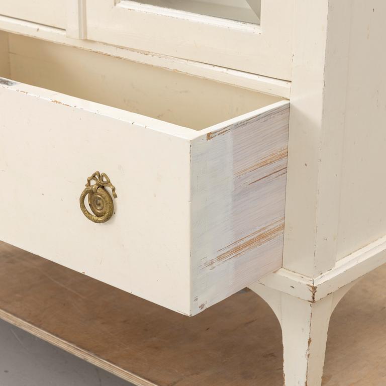 A display cabinet, early 20th century.