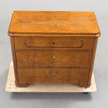 A late empire chest of drawers, mid 19th century.