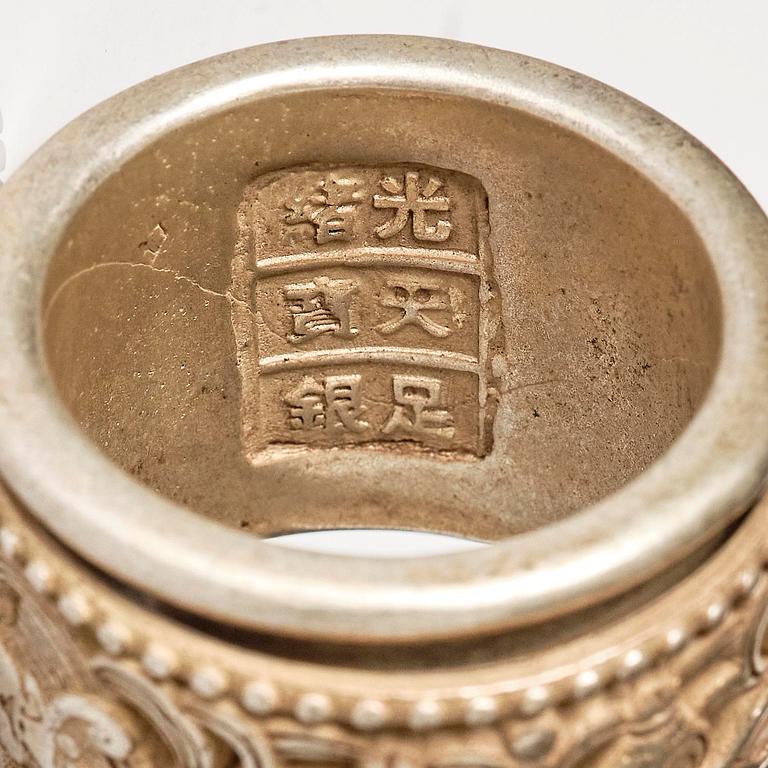 Two archers rings and two nephrite carvings.
