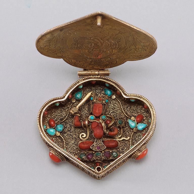 A filigree and jewelled Sinotibetan pendant/box, late 19th Century.