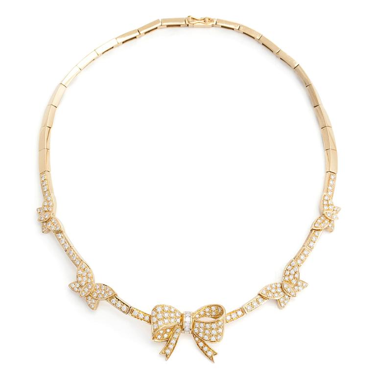 An 18K gold necklace, with brilliant- and baguette-cut diamonds totaling approx. 4.44 ct.