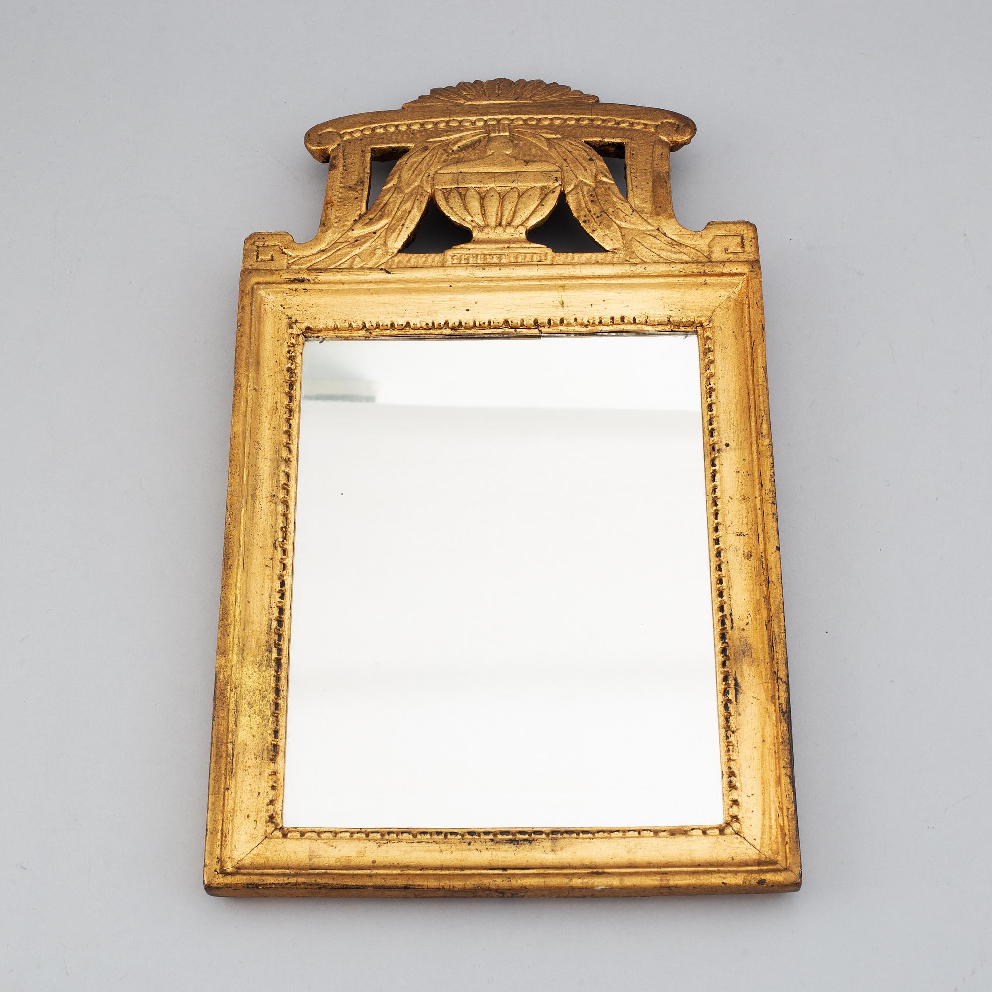 A Swedish 18th century gilt wood mirror.