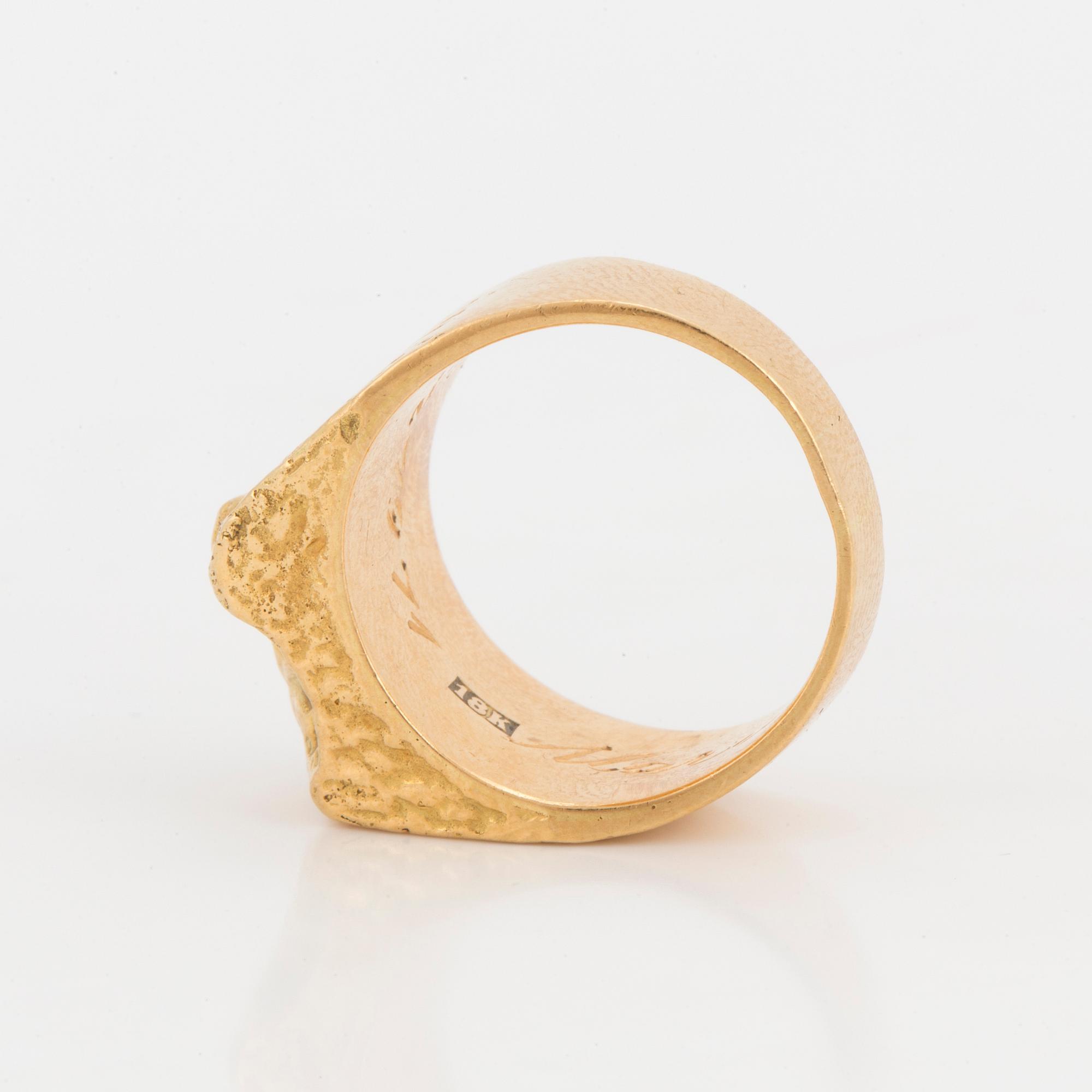 A ring with textured surface.