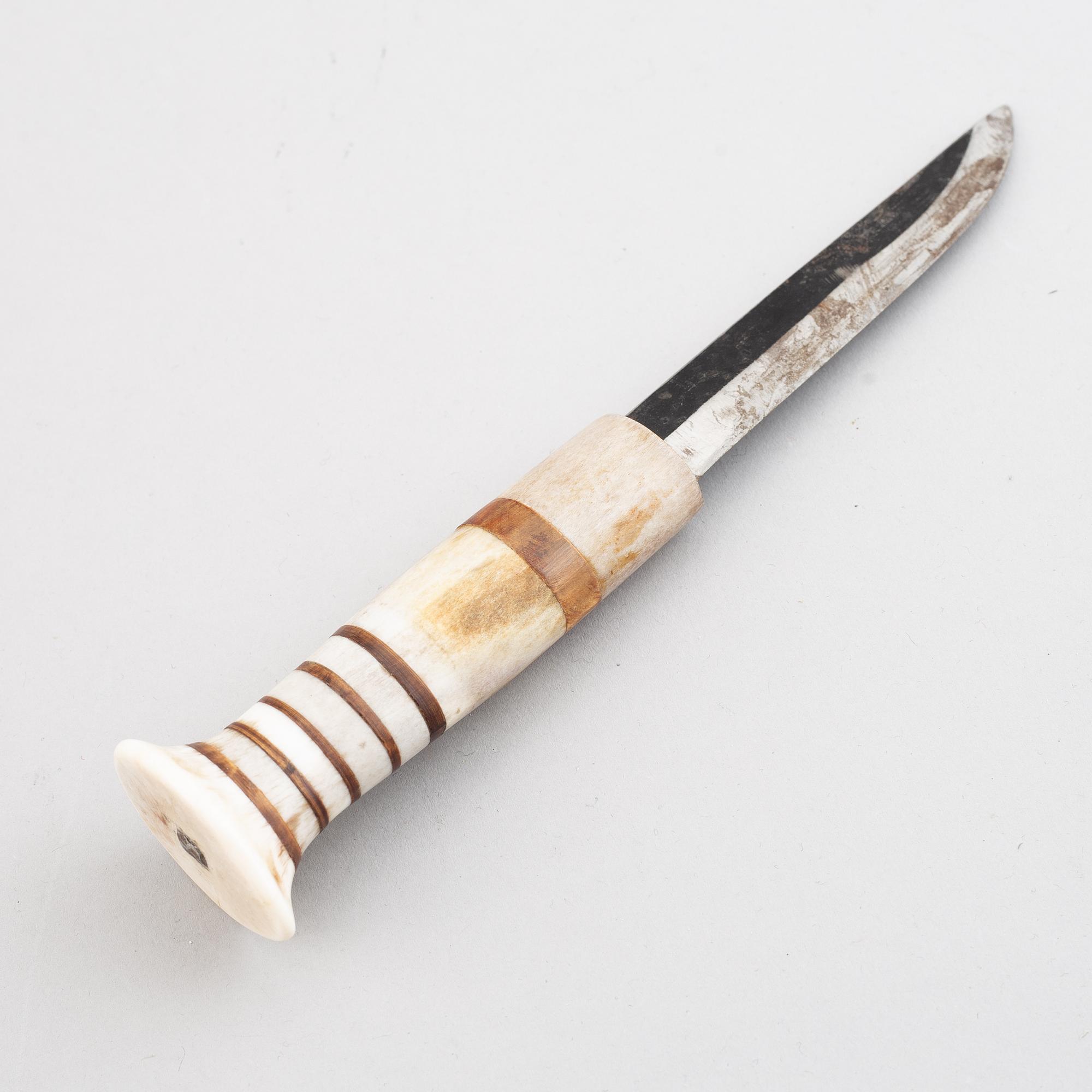 Lars Pirak, a Sami reindeer horn knife, signed Lars Pirak.