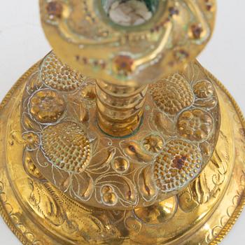 A Swedish repousse-brass baroque candlestick, circa 1700.