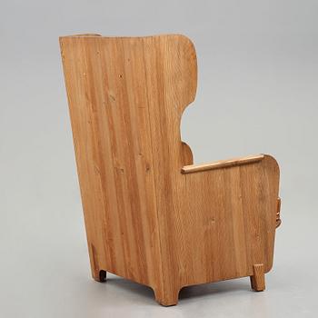 Axel Einar Hjorth, a "Lovö" stained pine armchair, Nordiska Kompaniet, Sweden, 1930's.