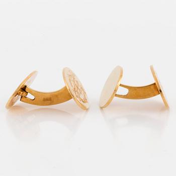 A pair of cufflinks, 18K gold, with monogram.