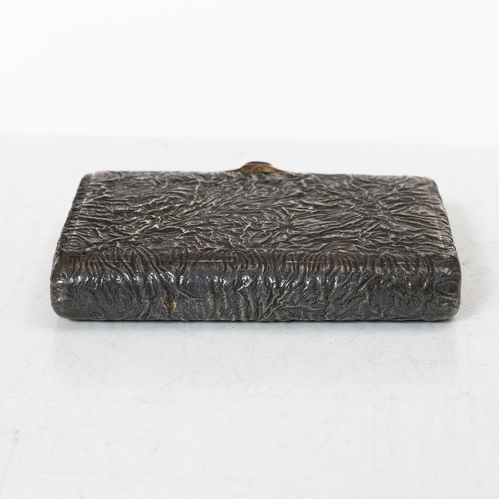 A Russian silver samorodok cigarette case, St. Petersburg 1908-17, unidentified maker's mark, possibly Ivan Arkarov.